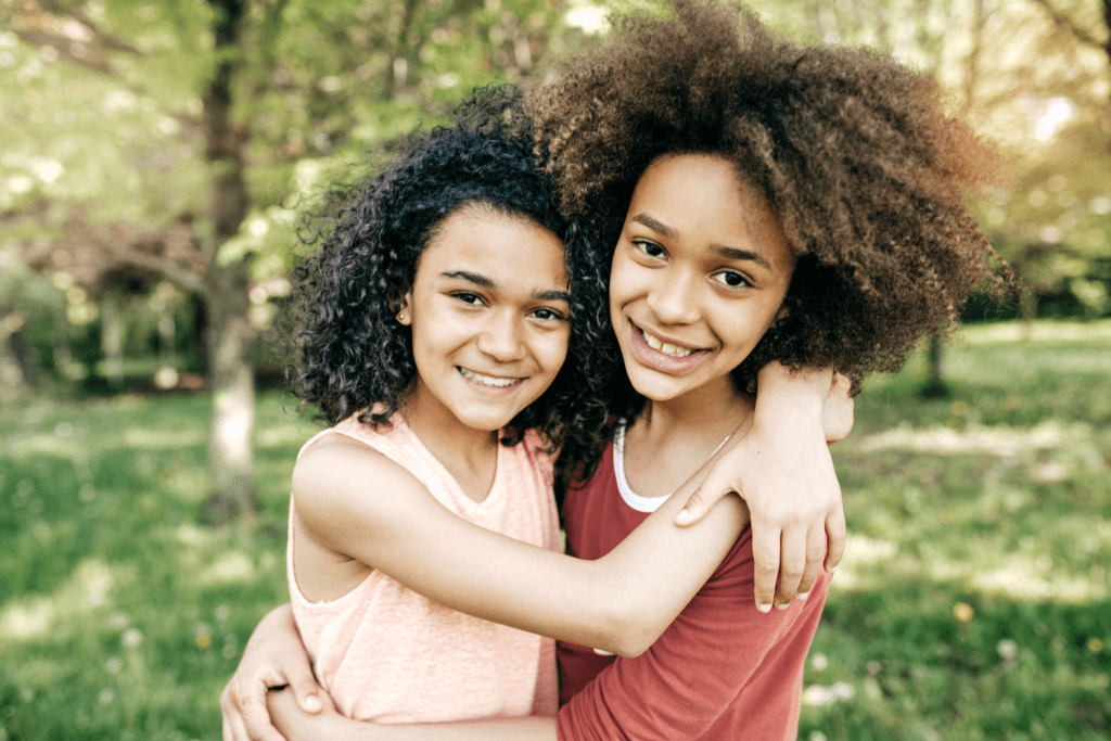 Dealing with sibling feuds - sisters hugging 