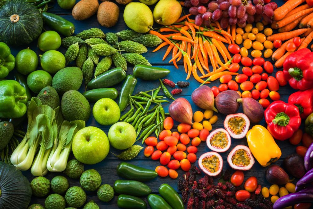 a spread of various fruits and vegetables