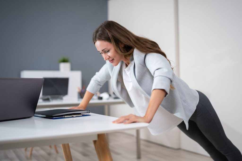 a woman working out in her office