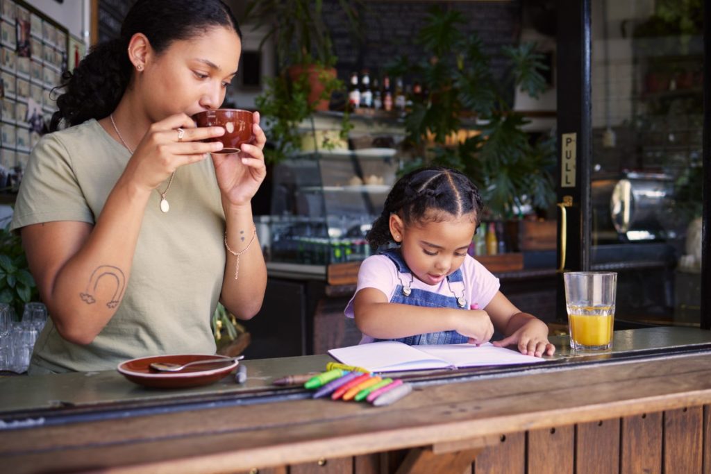 a mother and daughter at a coffee shop bonding