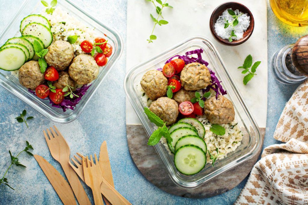 meal prep containers filled with a hearty meal