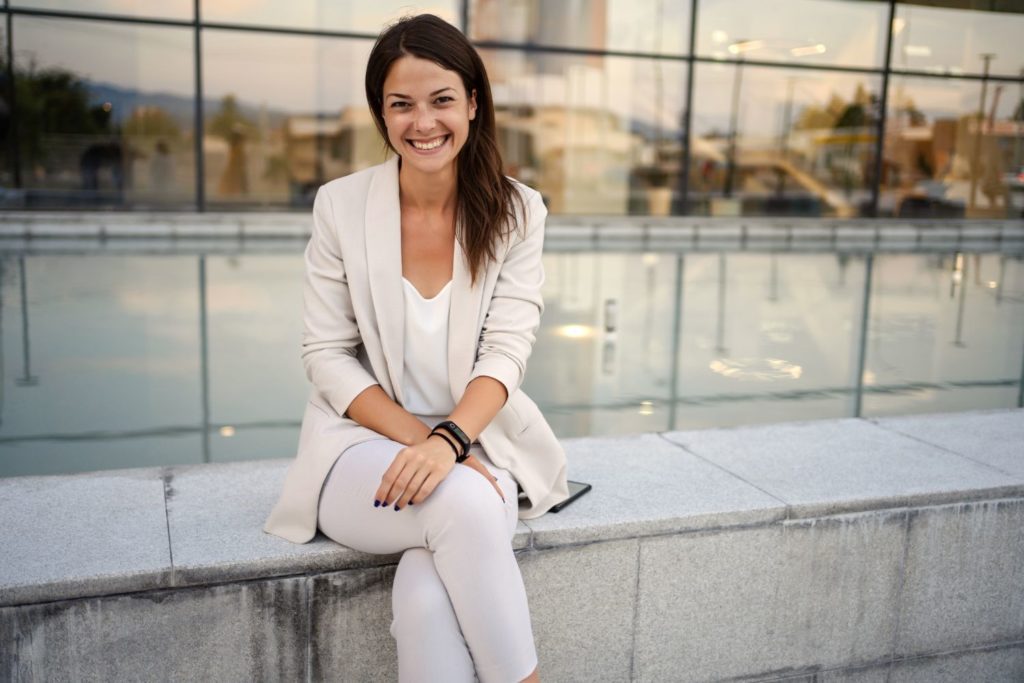 a woman posing for pictures for her brand promotion